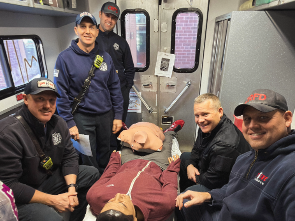 CRFD crew poses for a photo inside the SIM-IA truck
