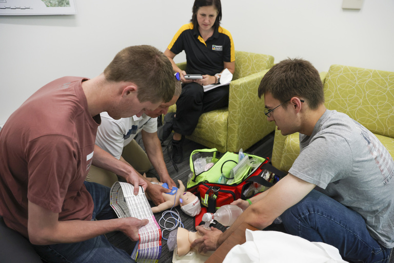 Paramedics participate in a a simulation training with SIM-IA staff at the Johnson County Ambulance Service in Iowa City, Iowa on Tuesday, June 7, 2022. (Photo by Rebecca F. Miller/College of Nursing)