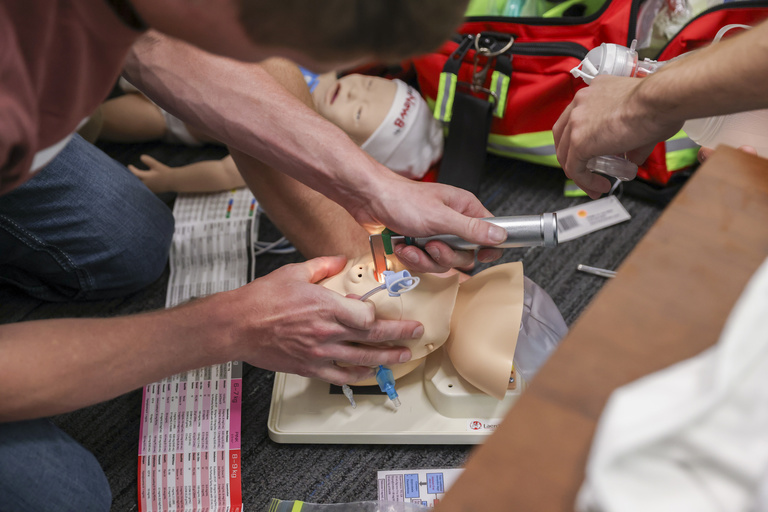 Paramedics participate in a a simulation training with SIM-IA staff at the Johnson County Ambulance Service in Iowa City, Iowa on Tuesday, June 7, 2022. (Photo by Rebecca F. Miller/College of Nursing)