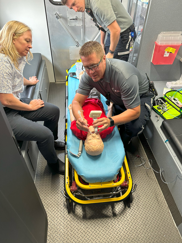 Two healthcare professionals with a manikin