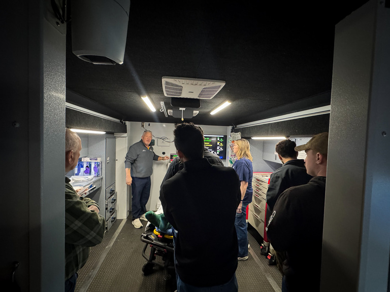 Participants in back of truck during mobile simulation
