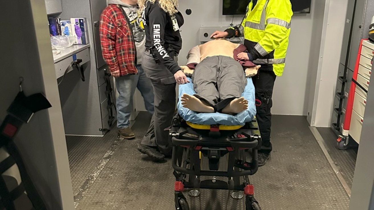 Two healthcare professionals with a manikin